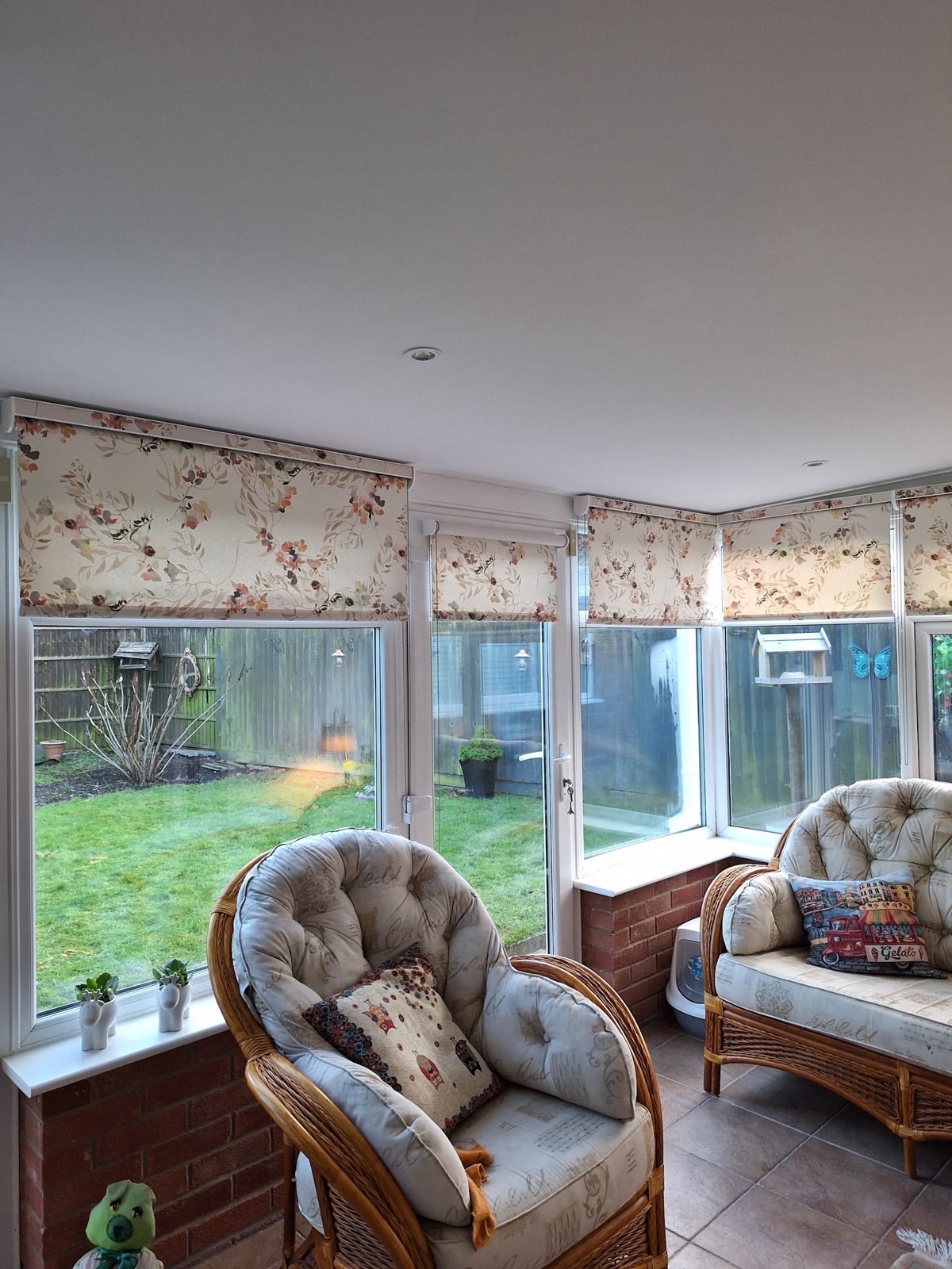 A finished conservatory with a solid ceiling, downlights and blinds, photographed by the customer